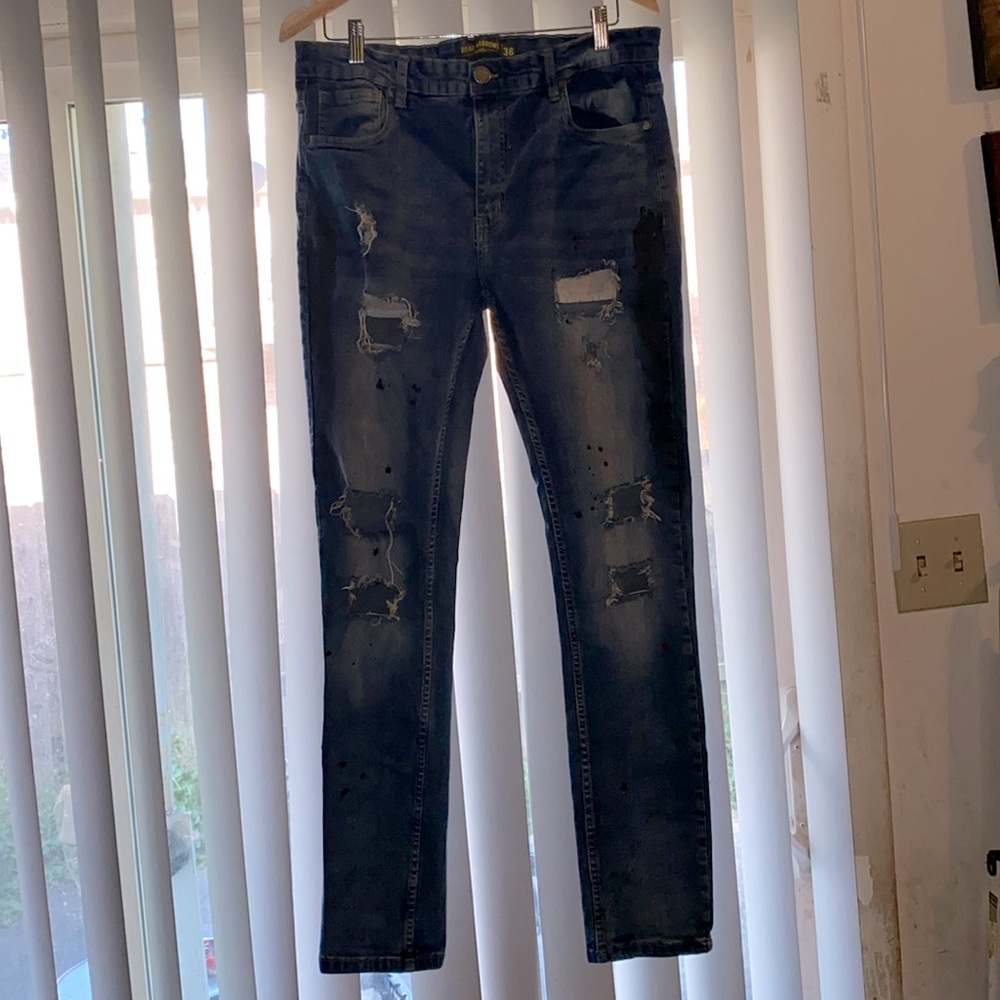 Men’s blue jeans with soldier theme on the front